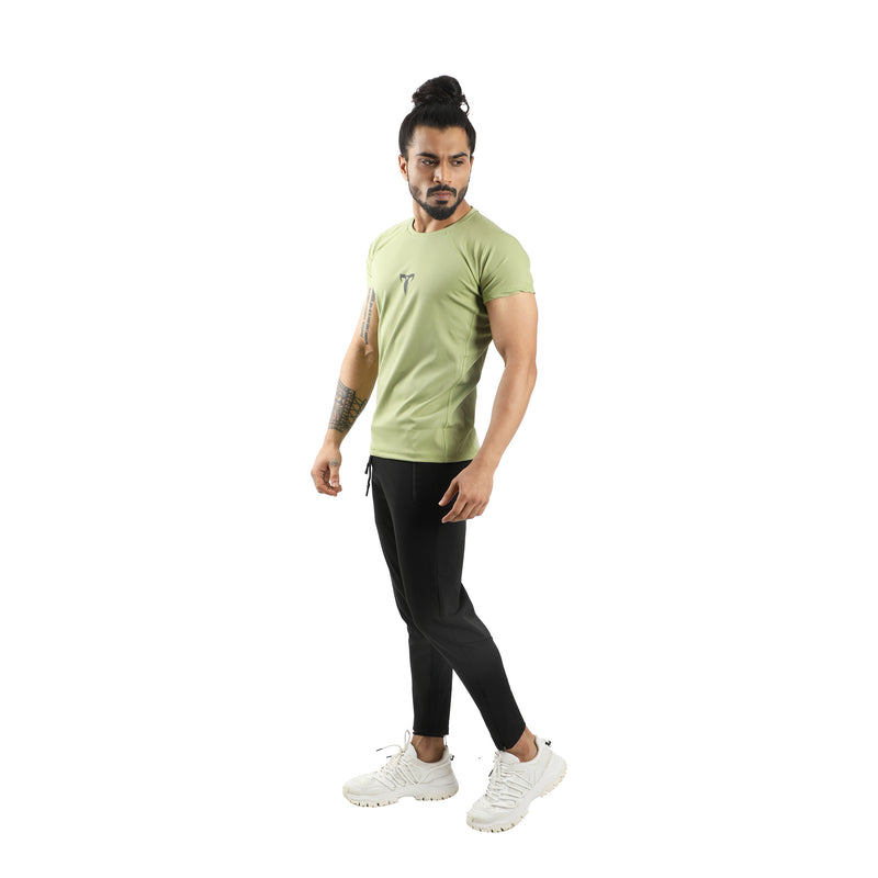 Men Wearing Pistachio Drifit Tshirt and Black Crop Pant.