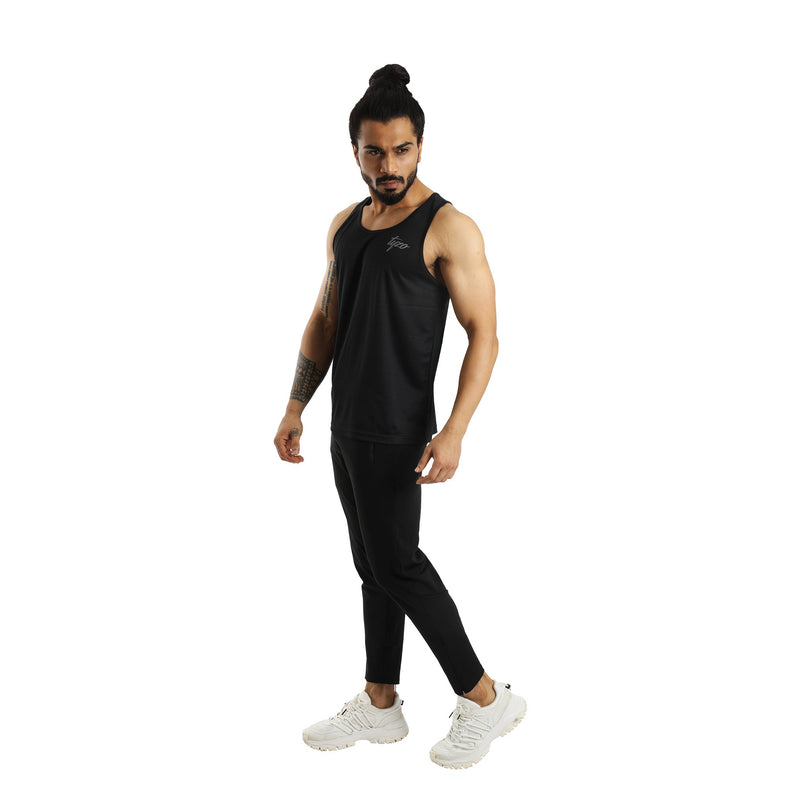 Men Wearing Tyzo Black Tank Top and Black Crop Pant